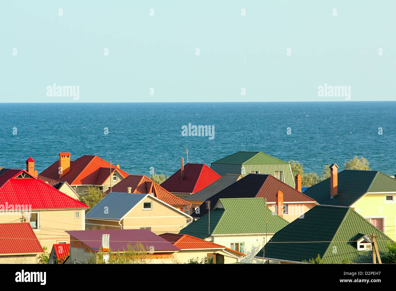 Colored roofs at the seaside with clear blue sky Stock Photo - Alamy