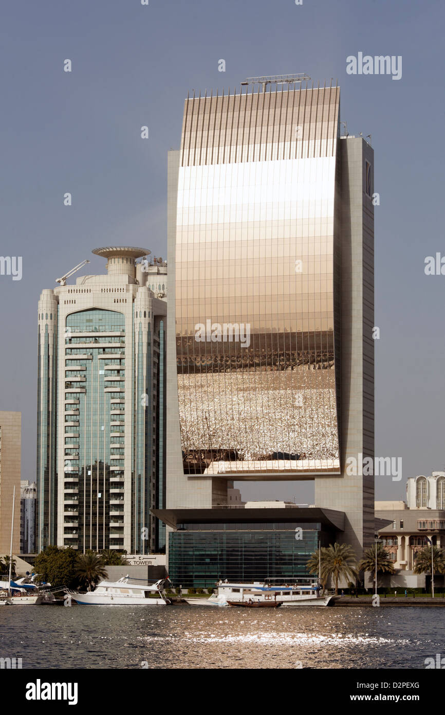 Dubai Creek reflected in modern riverside buildings Stock Photo - Alamy