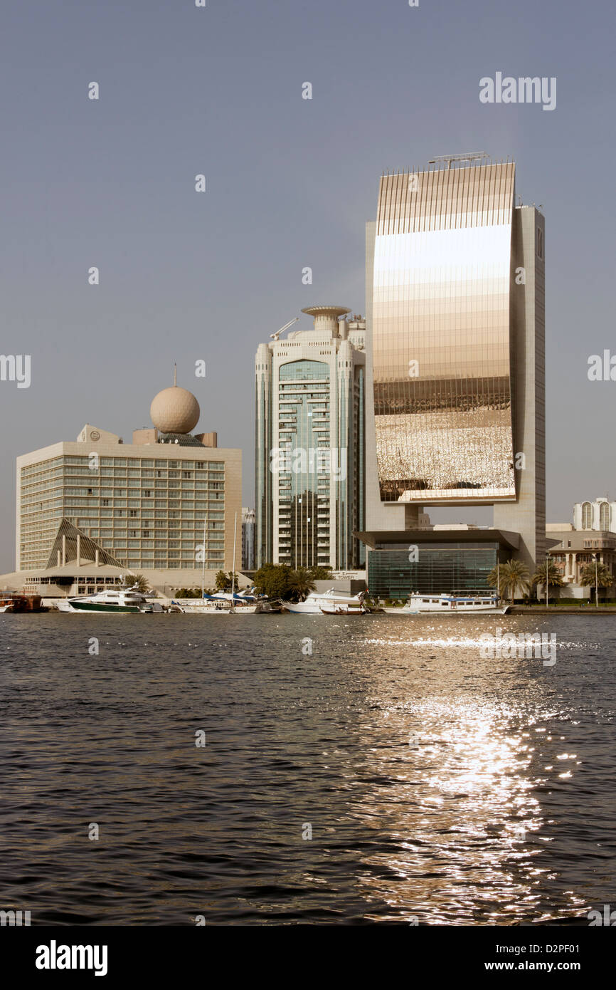 Dubai Creek reflected in modern riverside buildings Stock Photo - Alamy