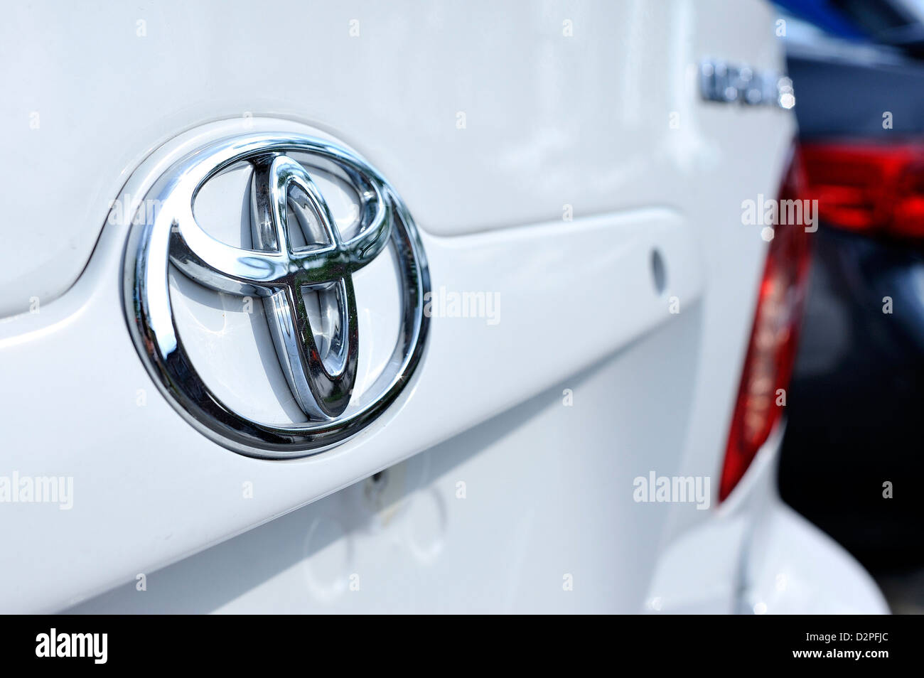 A Toyota logo photographed on a Toyota car. Stock Photo