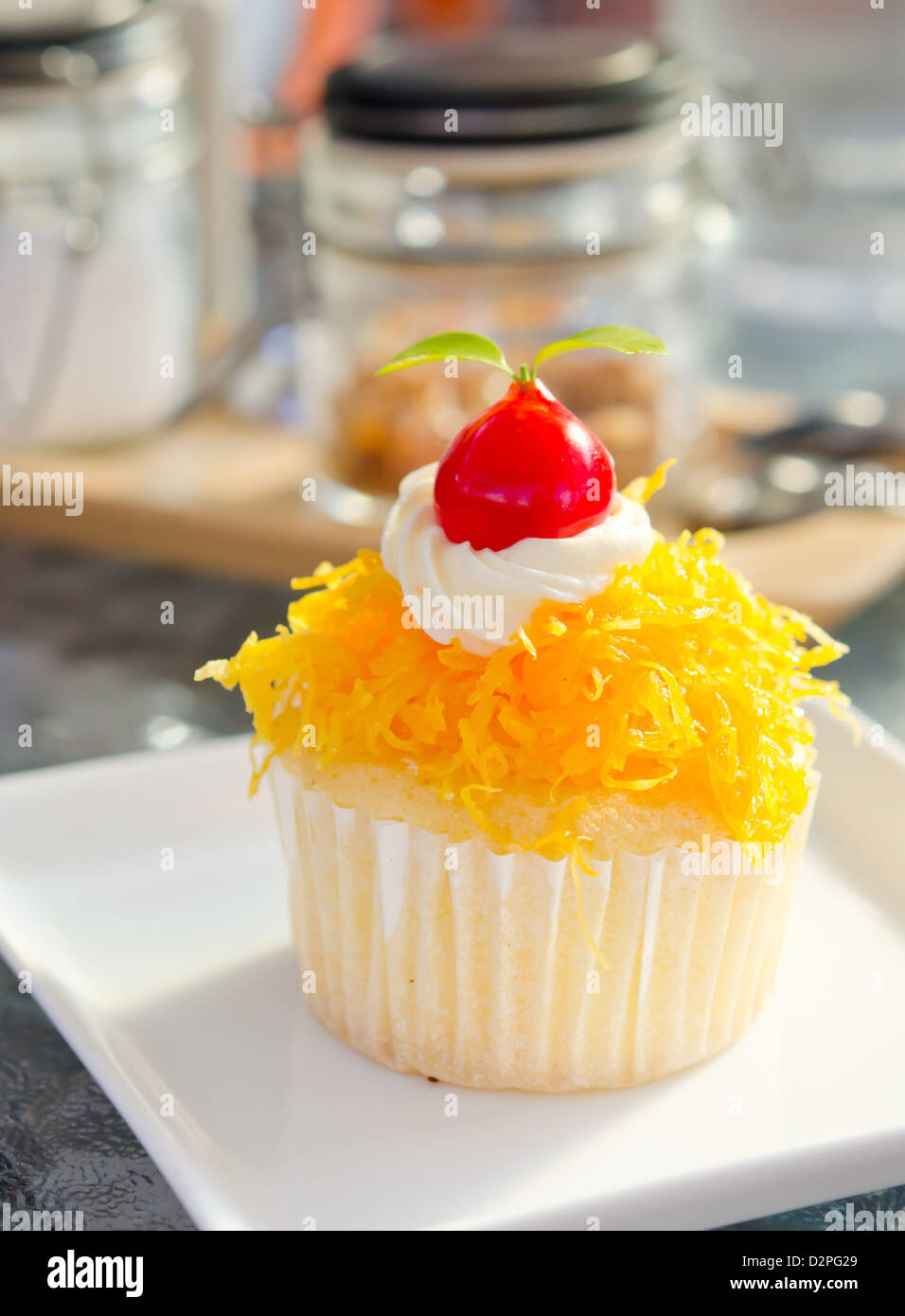 gold egg yolks thread with cherry and cream cake, thai dessert Stock Photo