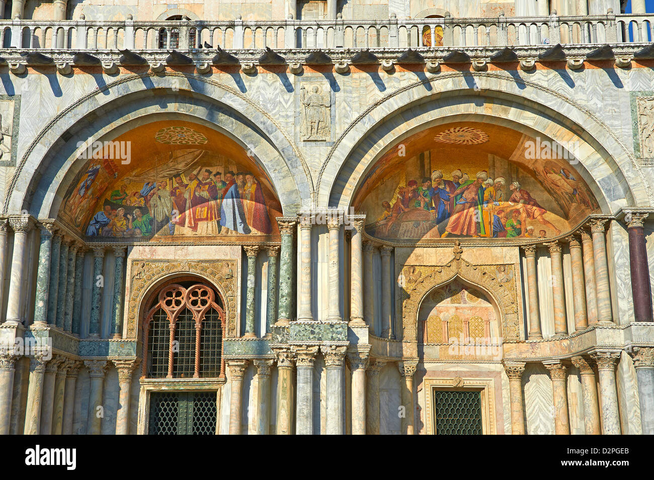 Facade with details of the Romanesque pillars & mosaics of St Mark's Basilica, Venice Stock Photo