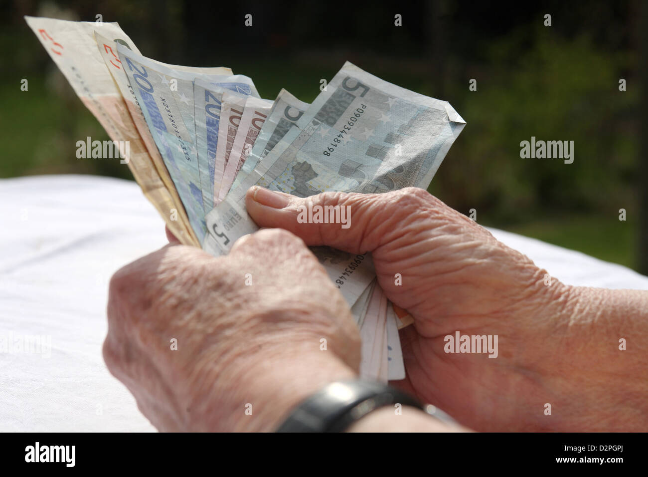 Berlin, Germany, a pensioner holds banknotes in his hand Stock Photo