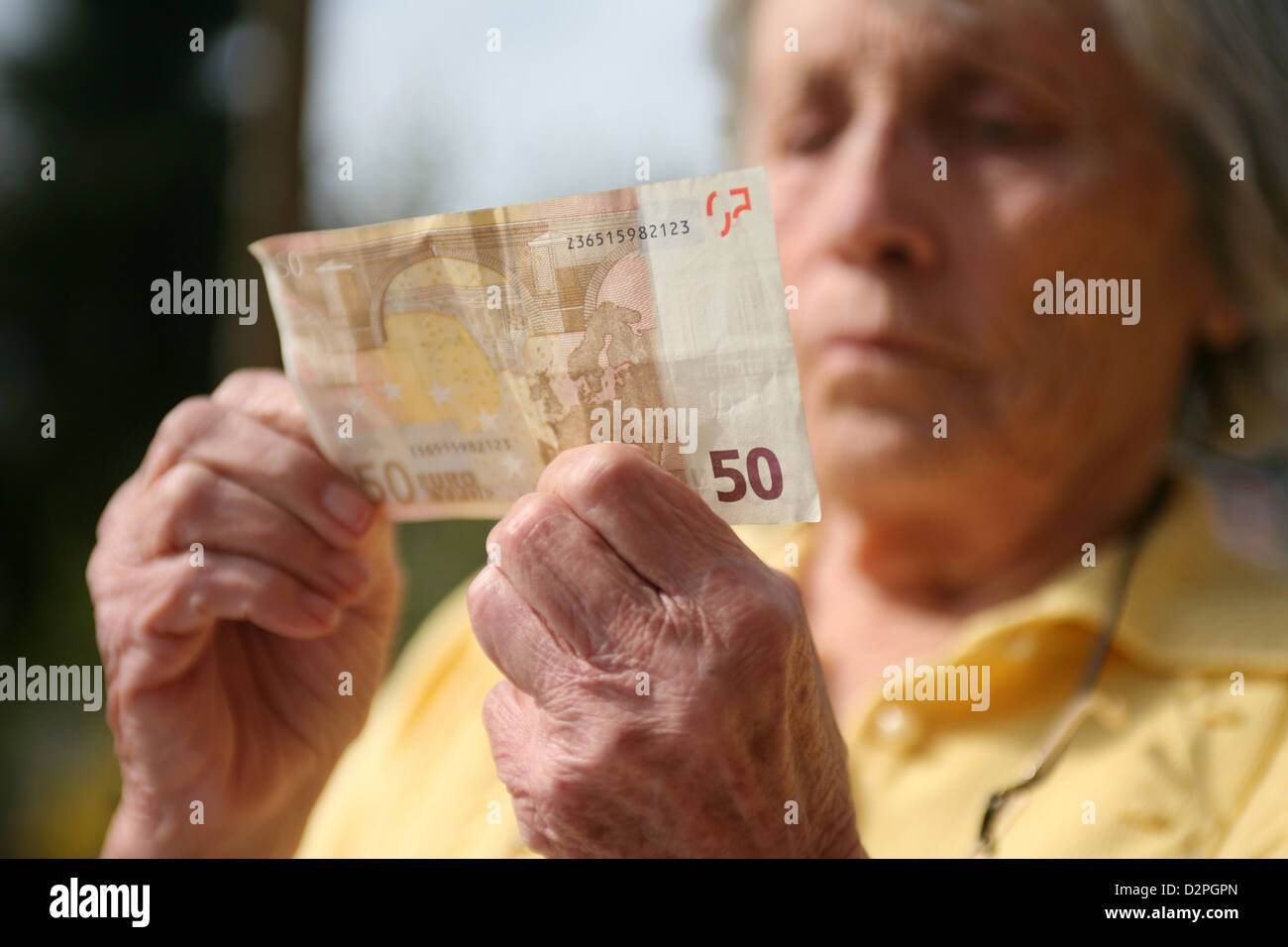 Berlin, Germany, the hands of a pensioner with a Euro bill Stock Photo