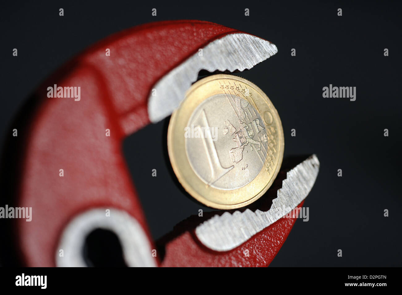 Berlin, Germany, a euro in the forceps Stock Photo