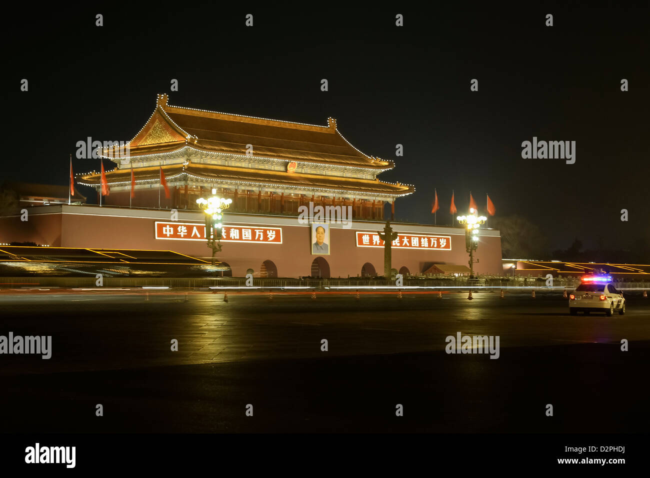 Gate of Heavenly Peace at Tiananmen Square in Beijing, China by night, with city traffic Stock Photo