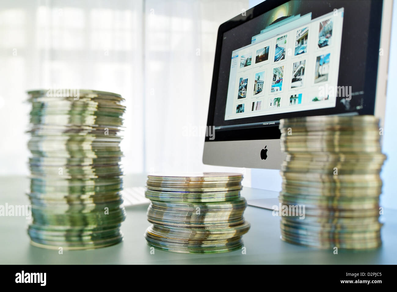 Hamburg, Germany, symbolic photo, CD stack before the new Apple iMac Stock Photo