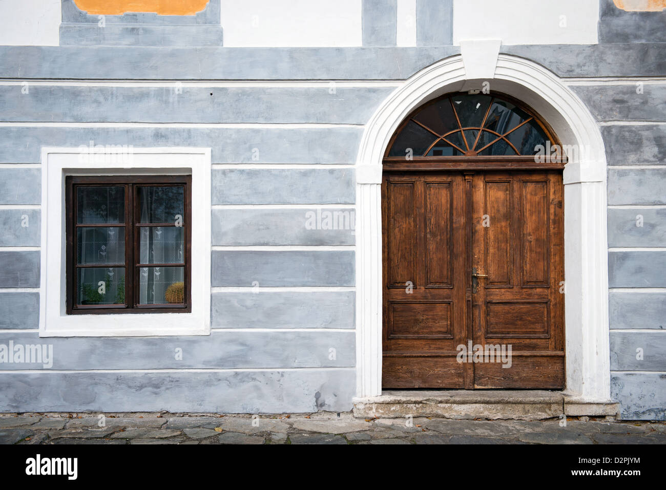 wooden door and window with blue grungy facade Stock Photo - Alamy