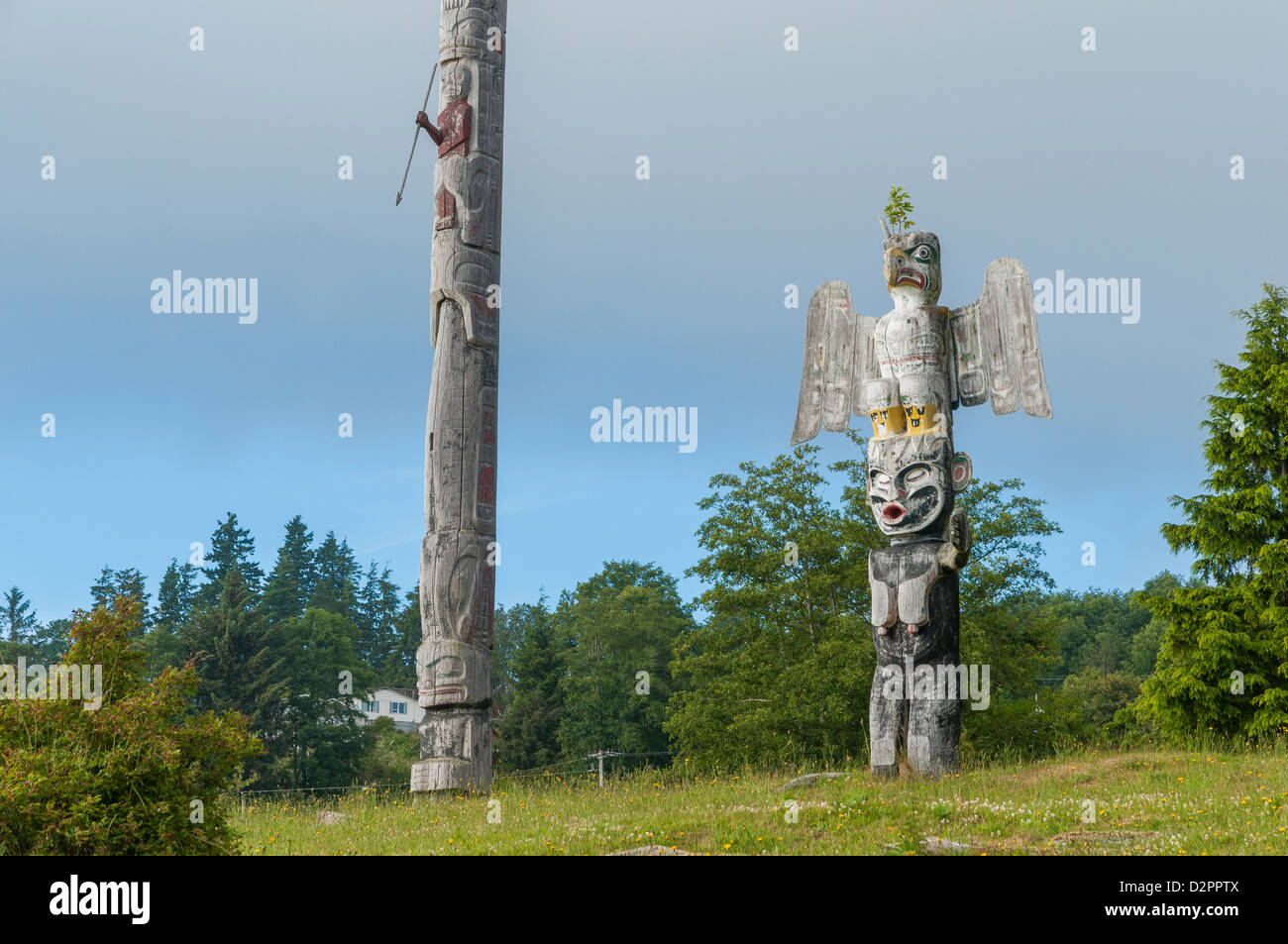 Totem poles in cemetary, Alert Bay, Cormorant Island, British Stock