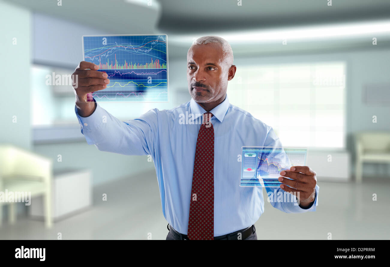 Black businessman using digital display Stock Photo
