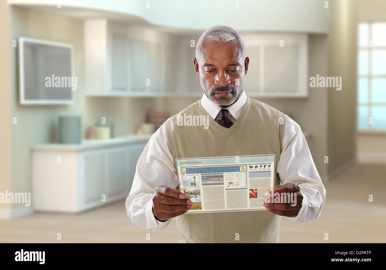 Black businessman using digital tablet in office Stock Photo - Alamy