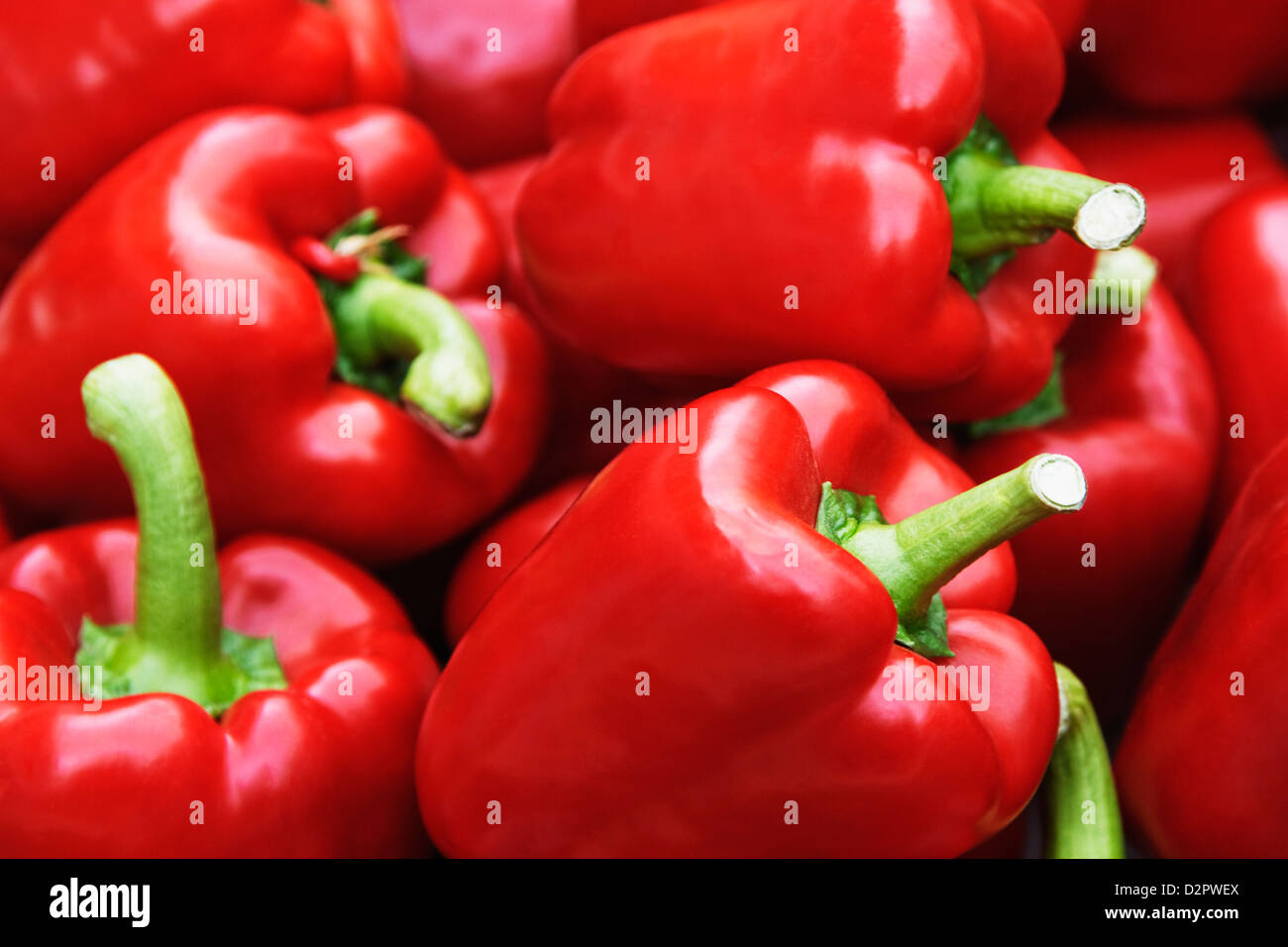 Close-up of red bell peppers at a market stall Stock Photo - Alamy