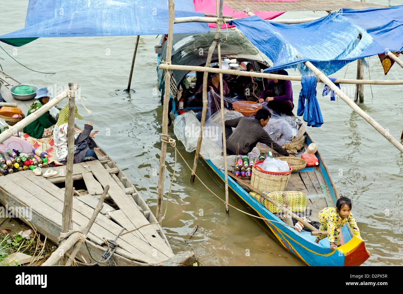 Floating village on the Mekong river in Phnom Penh , 500 meters from some of the most expensive city hotels. Stock Photo