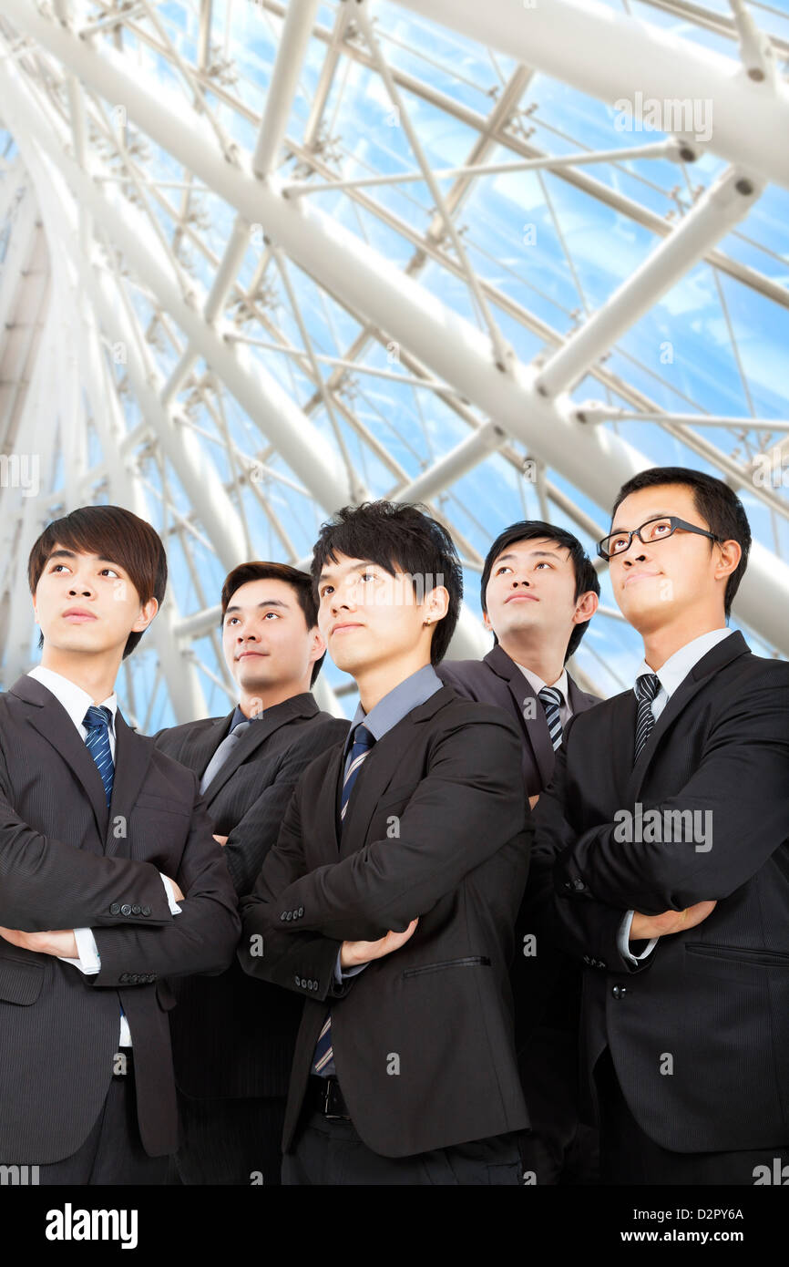 young business team standing in the modern office Stock Photo - Alamy
