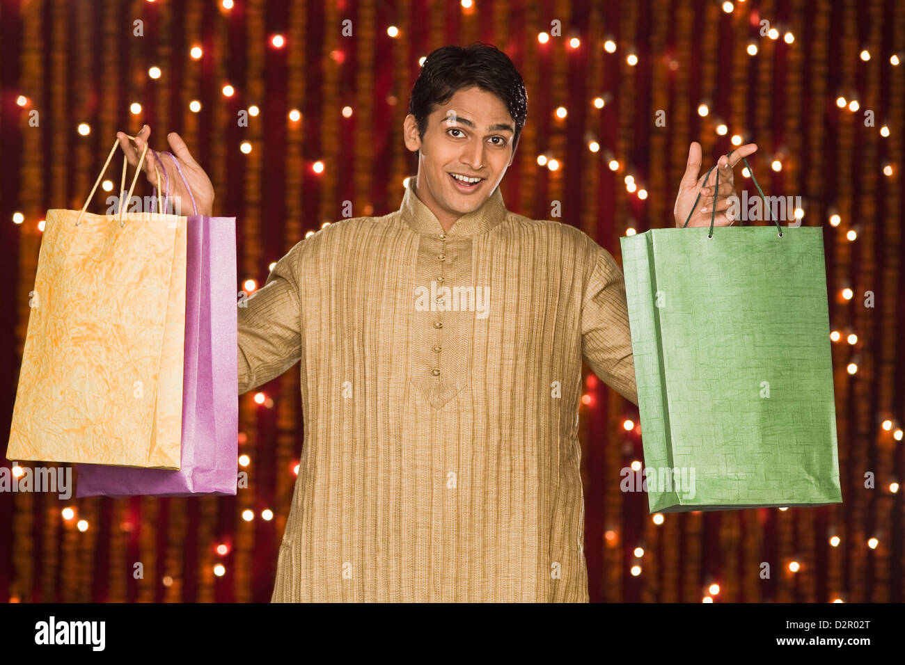 Man holding shopping bags Stock Photo - Alamy