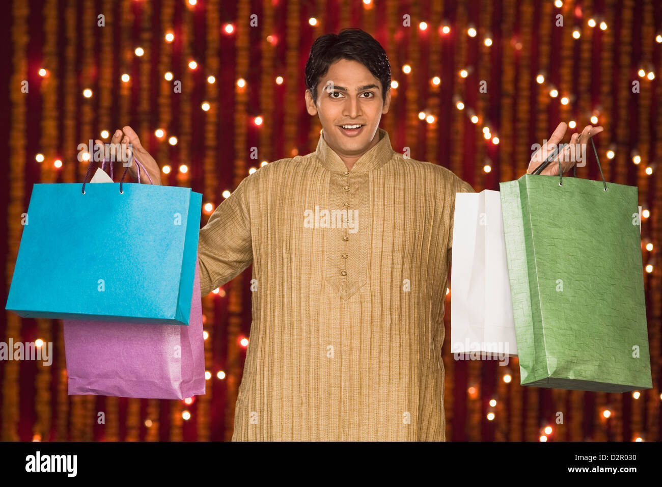 Man holding shopping bags Stock Photo - Alamy