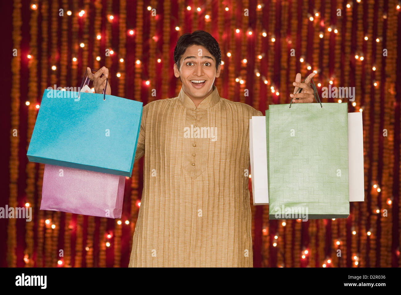 Man holding shopping bags Stock Photo - Alamy