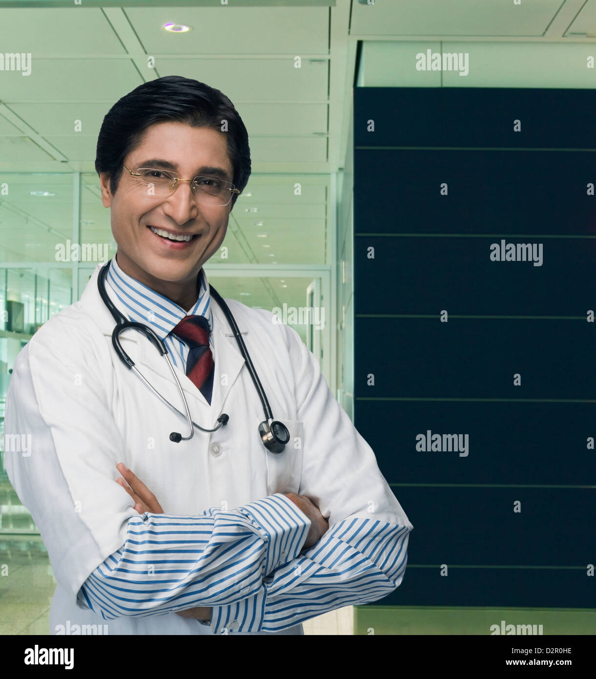 Portrait of a male doctor smiling Stock Photo - Alamy