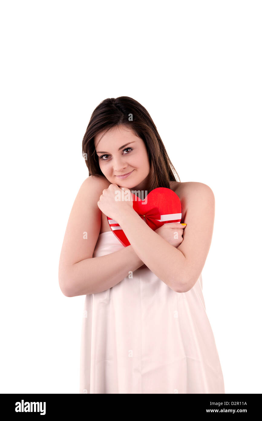 Beautiful girl with a heart shape in her hands isolated on white studio ...