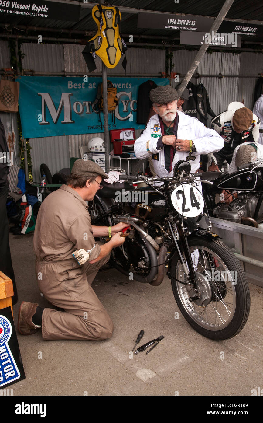 Classic Motorcycle being repaired in the paddock at the Goodwood Revival meeting Stock Photo