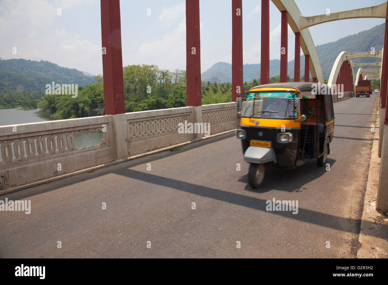 Tuk tuk crossing the Neriamangalam Bridge in Munnar, Kerala, India, Asia Stock Photo