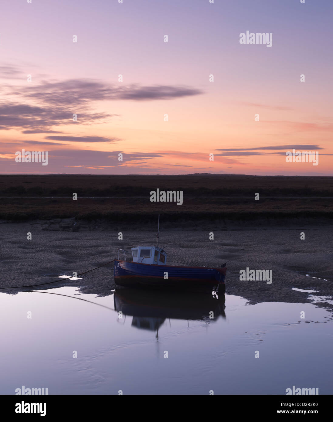 Subtle evening colours above a tidal channel at Burnham Overy Staithe, Norfolk, England Stock Photo