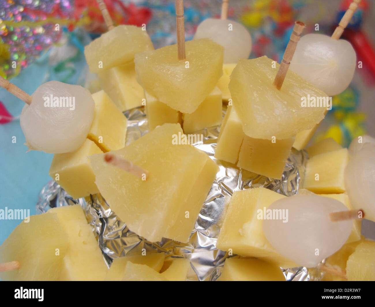 Retro party snack of Cheddar cheese and pineapple chunks / pickled