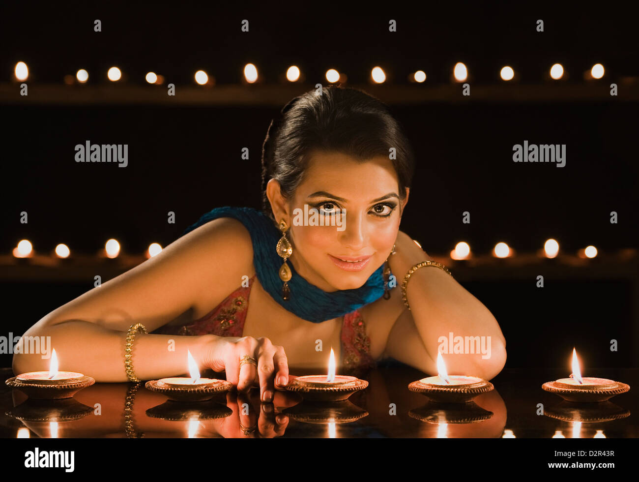 Woman decorating oil lamps in Diwali festival Stock Photo Alamy