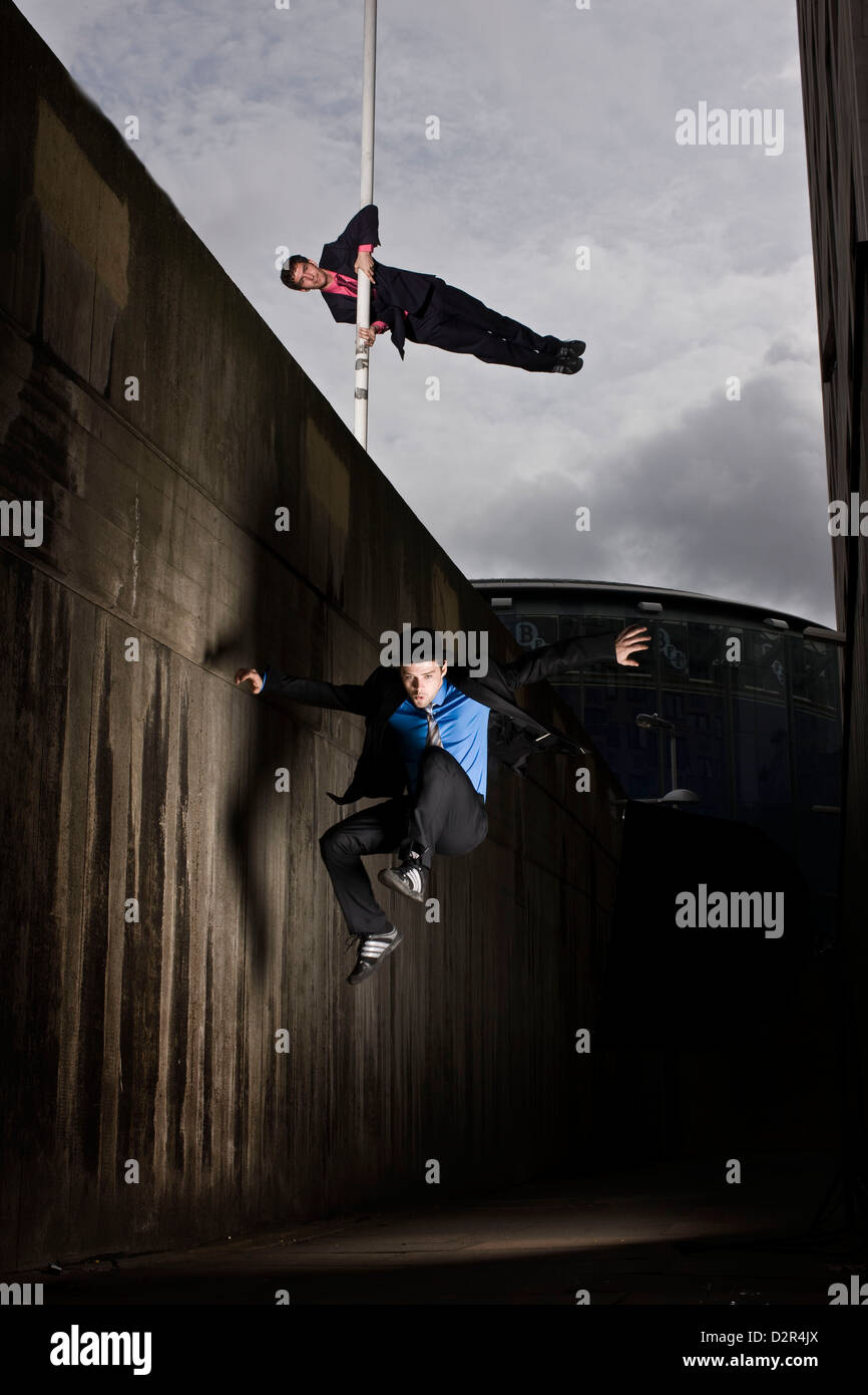 Parkour runners in alley, London, UK Stock Photo