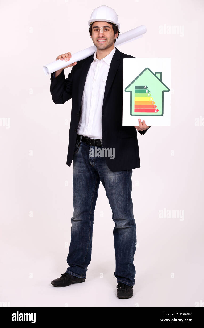 Architect stood with energy rating poster Stock Photo