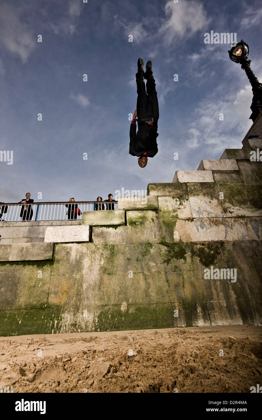 Parkour runner suspended upside down in mid air Stock Photo - Alamy