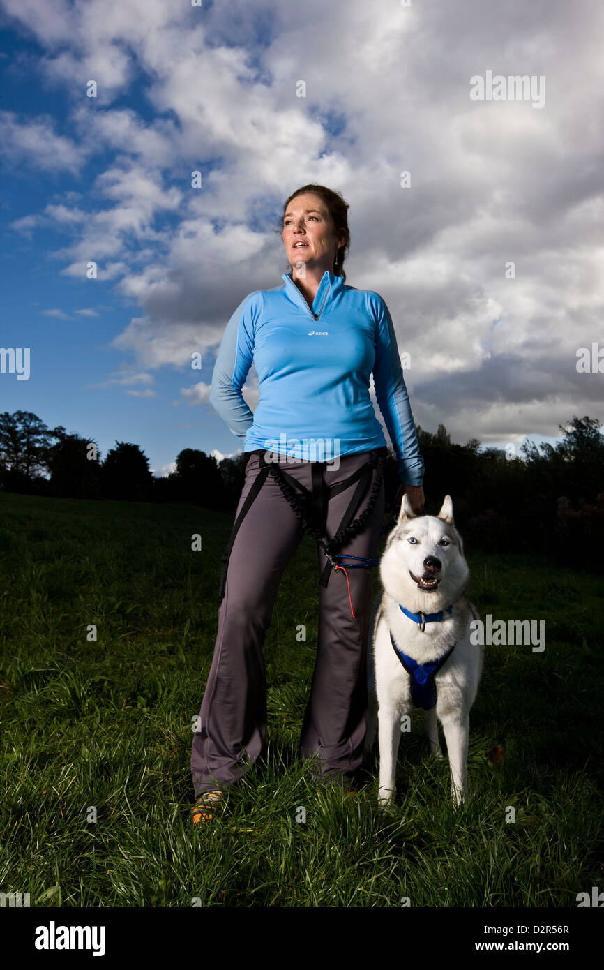 Portrait of dog owner with husky, Pride Stock Photo