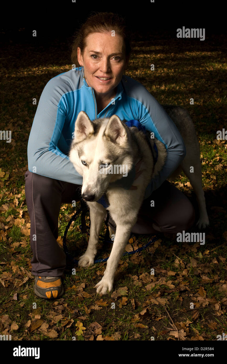Portrait of dog owner with husky, affection Stock Photo