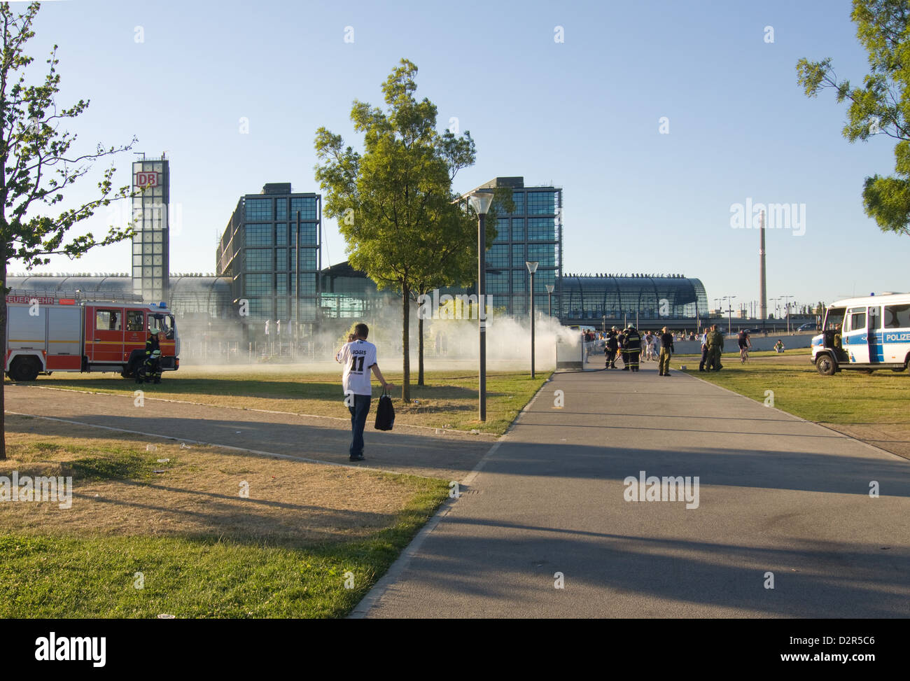 Burning garbage container in front of the main train station Stock Photo