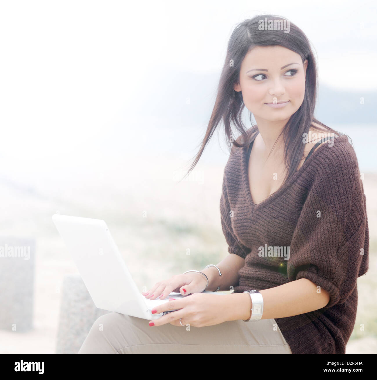 On the autumn beach with laptop. Stock Photo