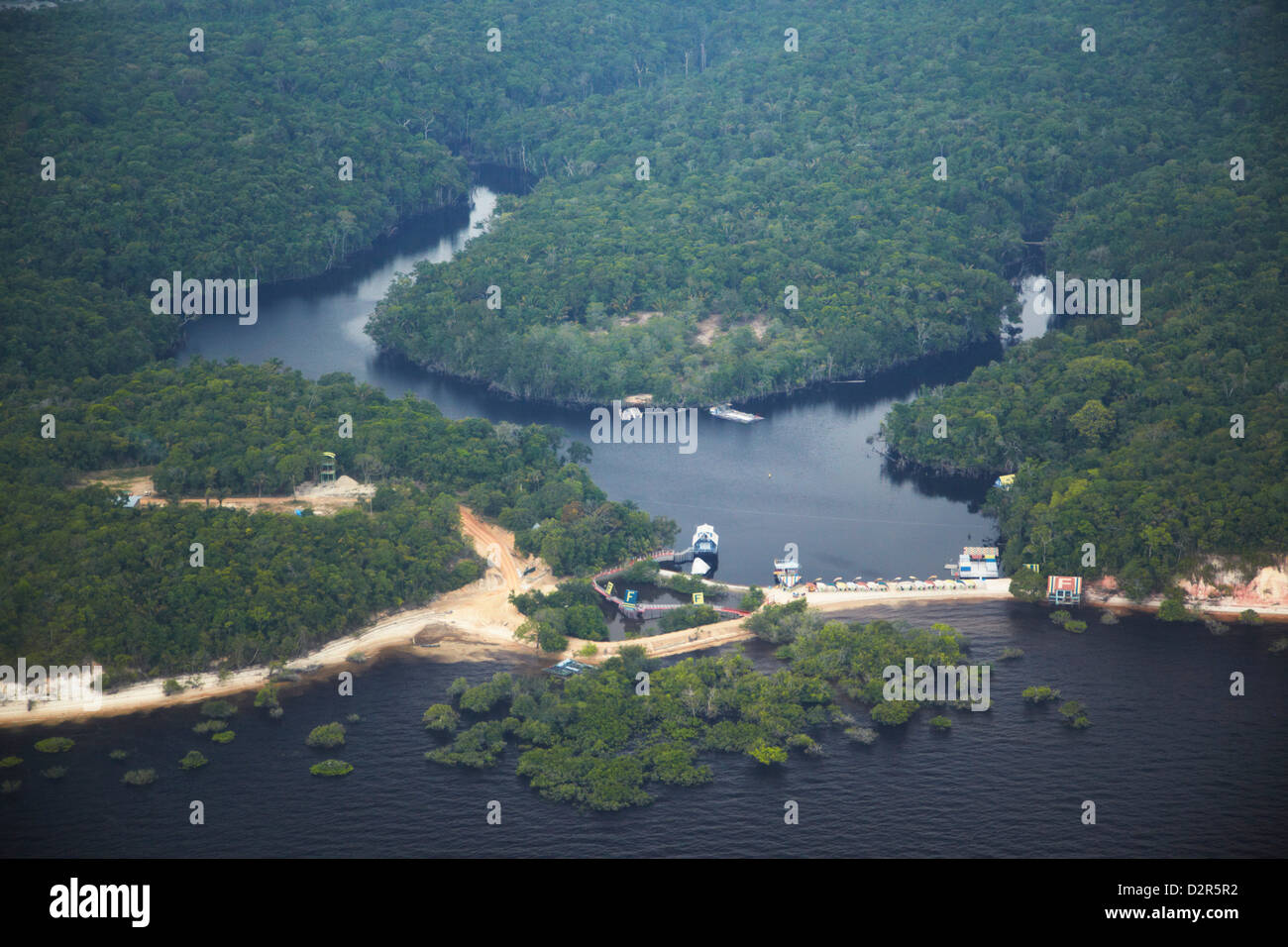 Aerial view of Amazon rainforest and beach resort along the Rio Negro