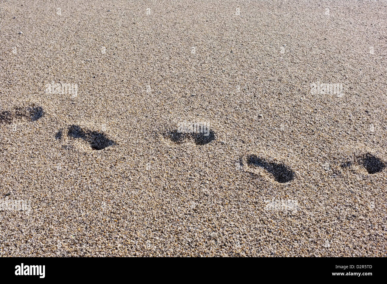 Footsteps in sand Stock Photo