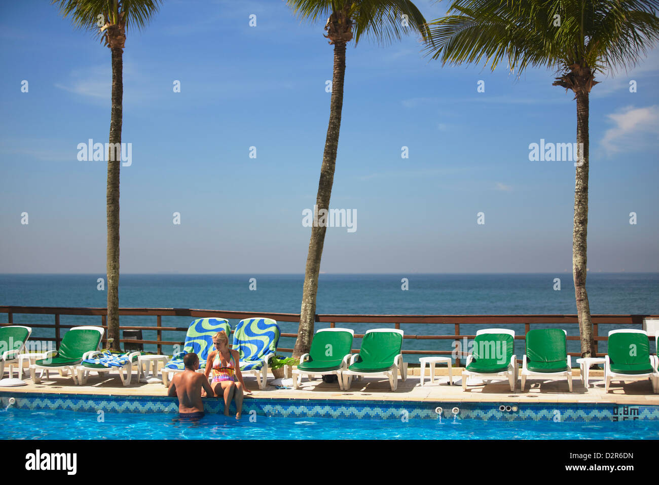 Couple relaxing by pool at Sheraton Hotel, Rio de Janeiro, Brazil, South America Stock Photo