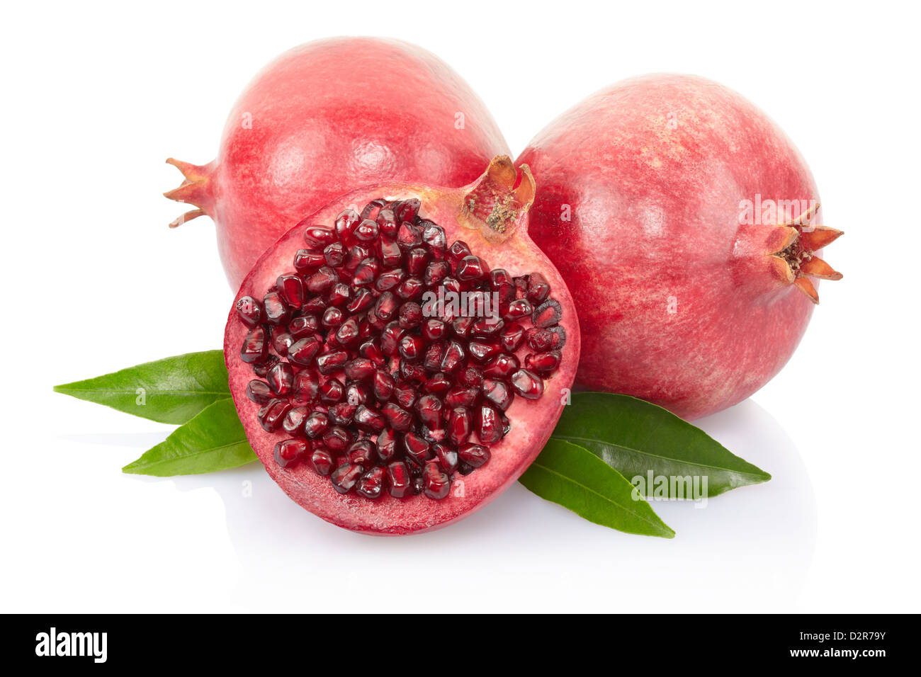 Pomegranate and section with leaves Stock Photo