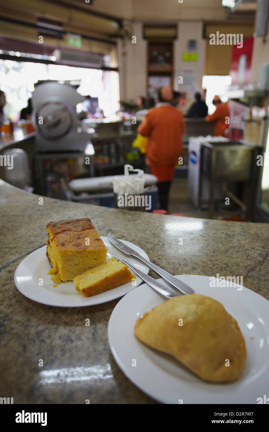Sopa paraguaya (cornbread with cheese and onion) and empanada in Lido Bar, Asuncion, Paraguay, South America Stock Photo