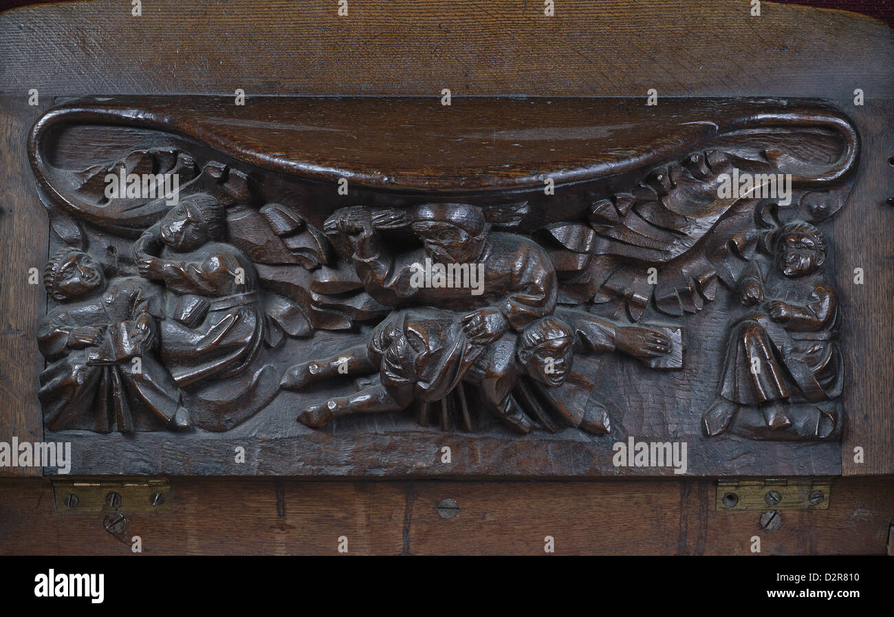 Sherborne Abbey misericord schoolboy being beaten Stock Photo