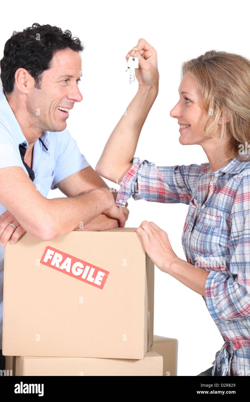 Couple moving into their new home Stock Photo - Alamy