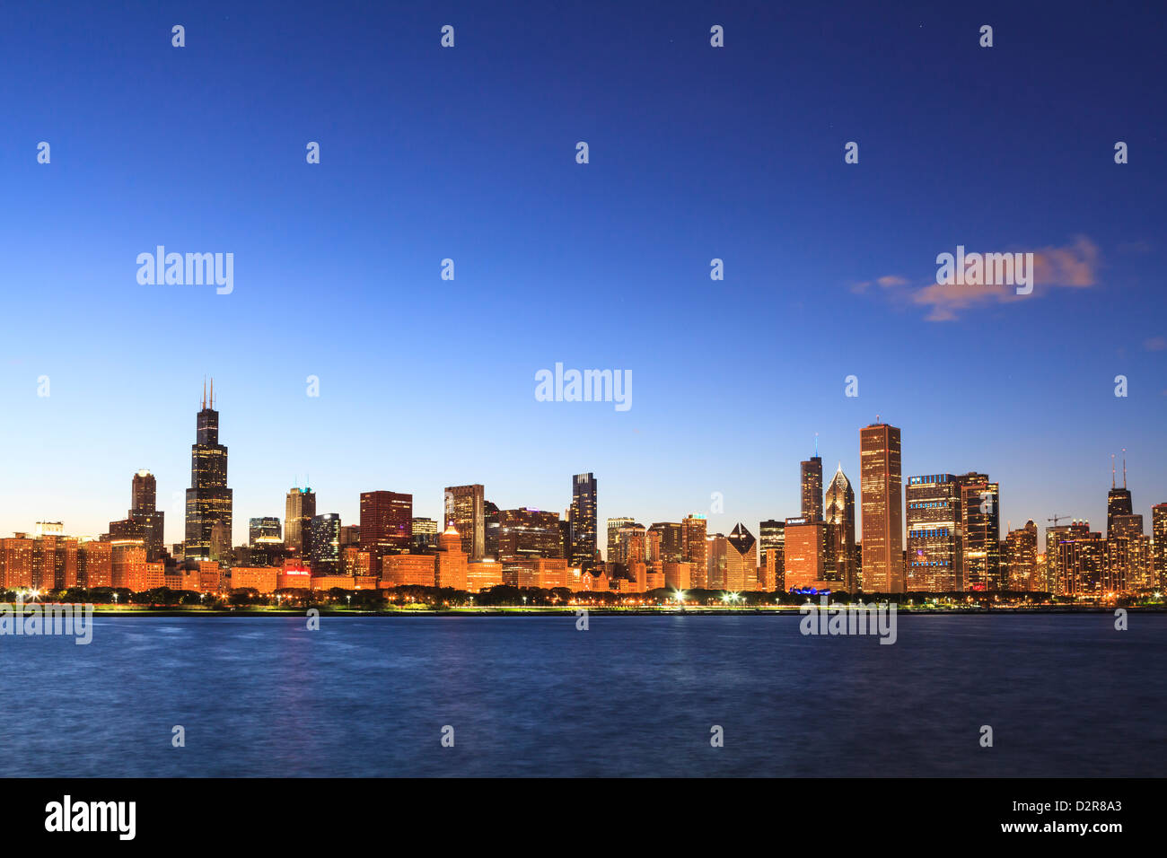 Chicago skyline and Lake Michigan at dusk with the Willis Tower, formerly the Sears Tower, on the left, Chicago, Illinois, USA Stock Photo