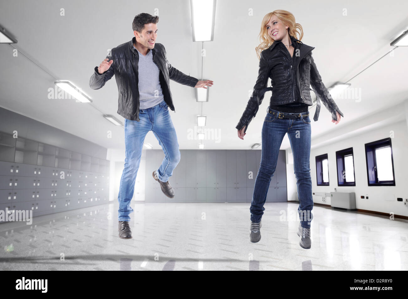 Happy young couple an a empty office Stock Photo