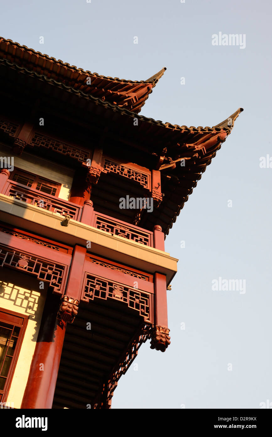 Traditional wooden Chinese architecture building furnished with classical decoration over the façade, Yu Yuan Garden, Shanghai. Stock Photo