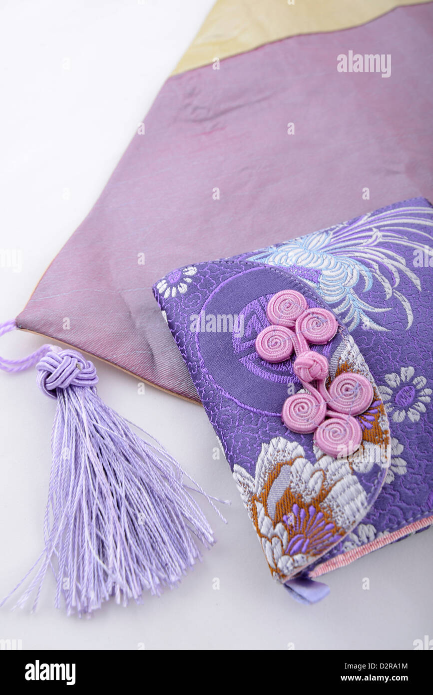 Elegant and Chinese style purse with beautiful purple flower motif pattern design, Shanghai, China. Stock Photo