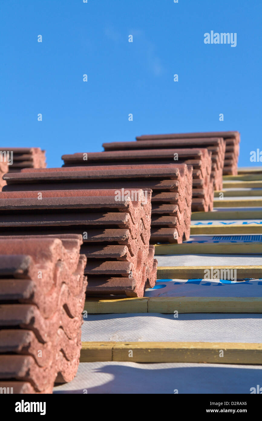 Stacks of roof tiles ready to lay Stock Photo Alamy