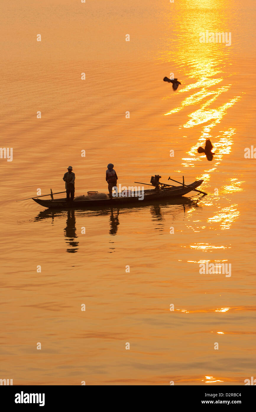 Fishermen at sunrise, Tonle Sap River, Phnom Penh, Cambodia, Indochina, Southeast Asia, Asia Stock Photo