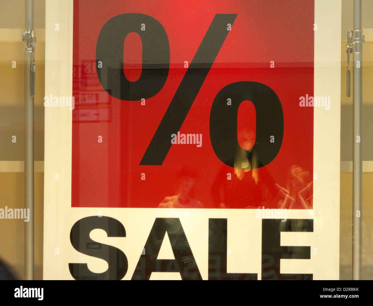 Consumer Passersby passing a discount Sale sign Stock Photo