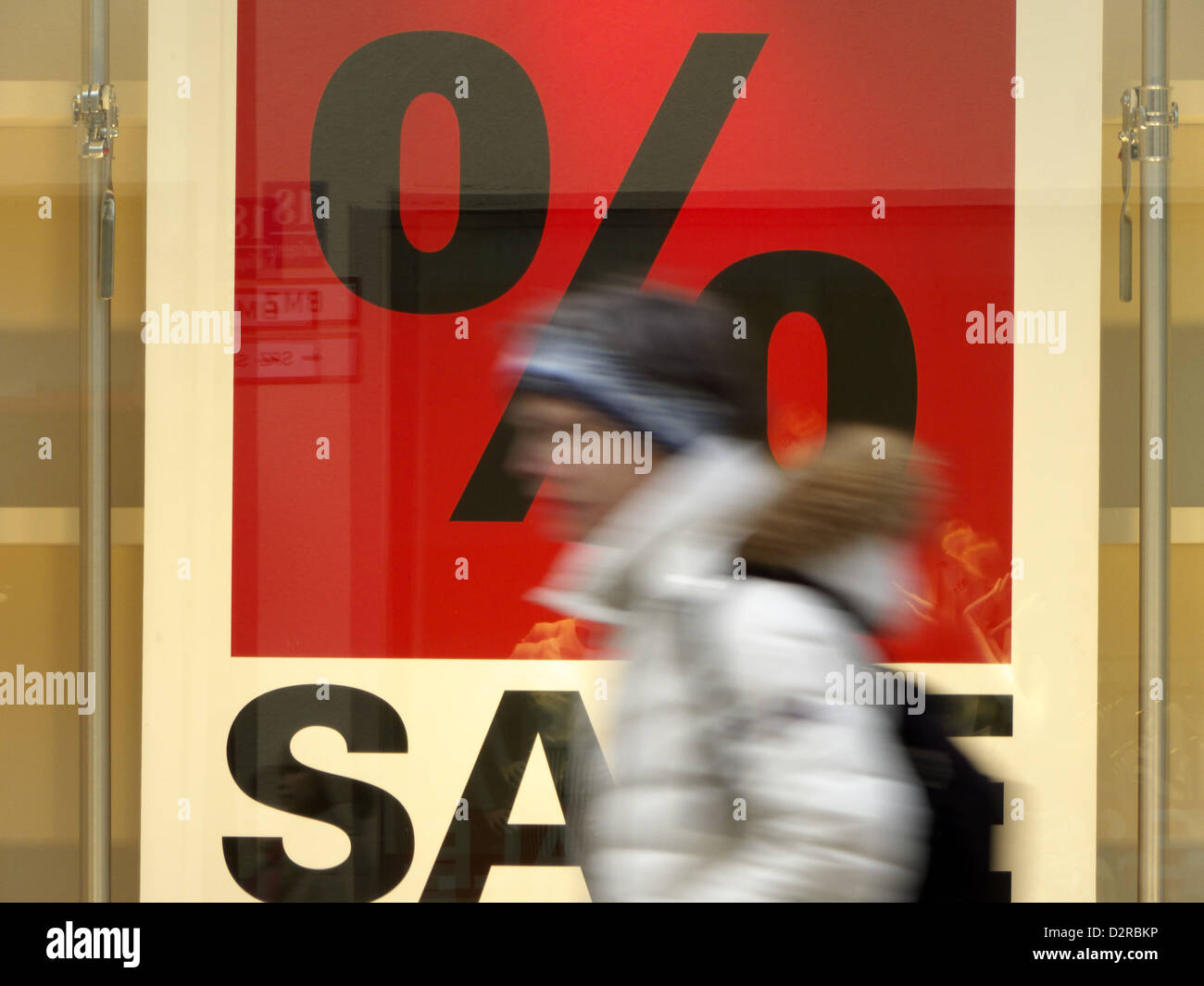 Consumer Passersby passing a discount Sale sign Stock Photo Alamy
